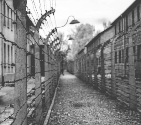 Photo for Poland, Auschwitz - April 18, 2014: Electric fence in former Nazi concentration camp Auschwitz I - Royalty Free Image