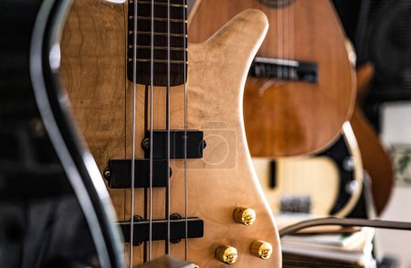 Photo for Bass guitar fretboardsand strings in music recording studio closeup. Musical instrument for live acoustic pop and rock perfomance - Royalty Free Image