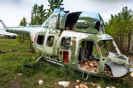 Photo for Destroyed military old helicopter at the airfield. Soviet Union army technique - Royalty Free Image