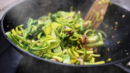 Photo for Meat with fresh vegetables cooking in asian wok pan. Asian healthy and delicious fast street food. - Royalty Free Image
