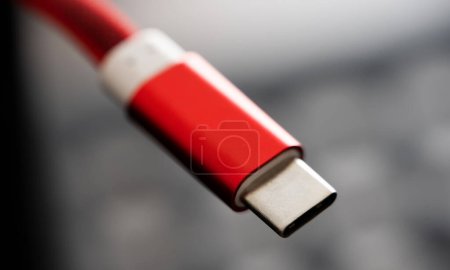 Photo for Red connector usb type C for smartphone and gadgets closeup. Plug micro cable for mobile devices in macro view - Royalty Free Image