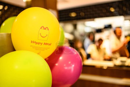 Photo for Berlin, Germany - 10 April 2023: advertising of Happy Meal on yellow balloons in McDonald's inside - Royalty Free Image