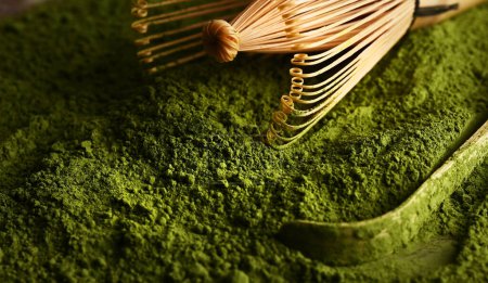 Photo for Matcha green tea powder in a bowl with a whisk for whipping - Royalty Free Image