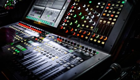 Photo for Audio adjusting control mixer with buttons, sliders and display. Digital music record mixer equipment for dj and musician media production - Royalty Free Image