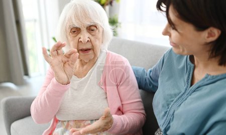 Photo for Old Woman Shares Life Story With Granddaughter As A Concept Of Generational Communication - Royalty Free Image