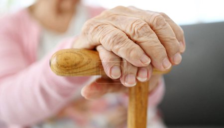 Photo for Hands Of Old Woman With Cane, Close Up View - Royalty Free Image