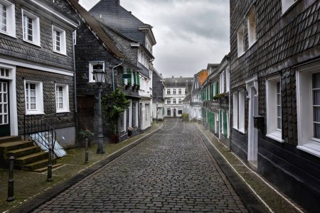 Photo for Hazy morning view to Traditional Slate houses in Solingen Greafrath, Germany - Royalty Free Image