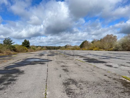 Abandoned runway Blackbushe Airport Hampshire UK with open land and nature