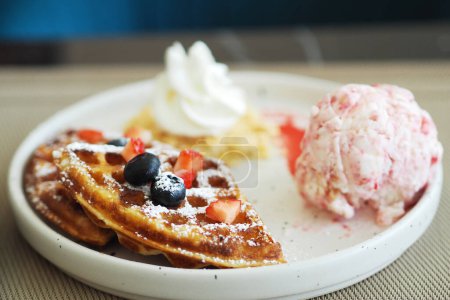 Photo for Waffles and Strawberry Ice-cream, Caramel syrup and fresh berry. - Royalty Free Image