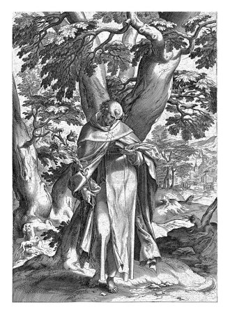 Foto de Paisaje con Santo Domingo, Antonie Wierix (II), después de Cornelis Cort, después de Bartolomé Spranger, 1573 - 1604 Santo Domingo en el bosque, sosteniendo un lirio en una mano, un libro abierto en la otra. - Imagen libre de derechos
