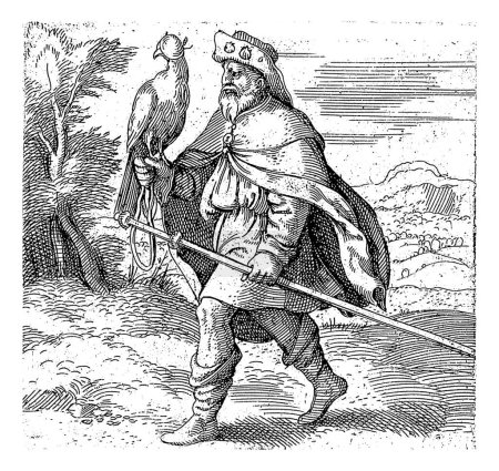 Foto de Exilio, Enea Vico, después de Francesco Salviati, 1533 - 1567 Un peregrino con sombrero y bastón, caminando con un halcón en la mano. En la parte superior derecha, una línea de texto latino. - Imagen libre de derechos