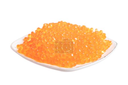 Photo for Red caviar in the ceramic plate isolated on a white background. Trout or salmom caviar close up. Macro shot. - Royalty Free Image