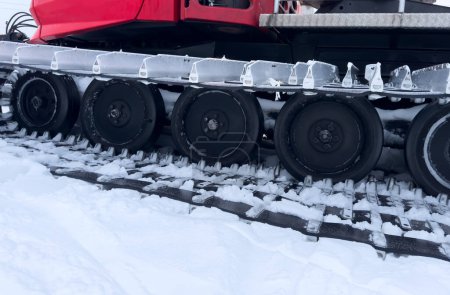 Snowcat machine for snow removal. Preparation ski trails. Snow groomer. Snowy tracks of snowcat in the mountains. Ratrac snowcat. Snow tucker