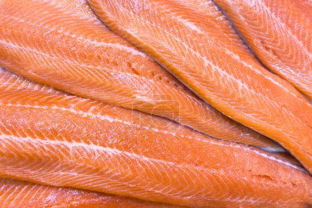 Truite poisson filet texture fond. Filet frais saumon sauvage patron. Surface du filet entier frais
