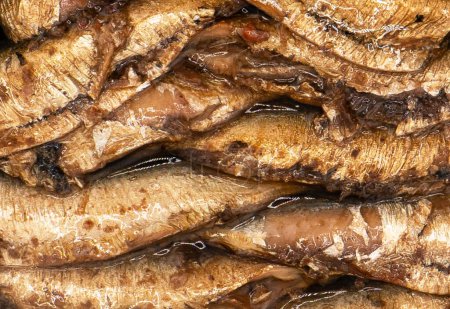 Photo for Sprats fish texture background. Top view. Sprats with oil. Smoked canned sprats - Royalty Free Image