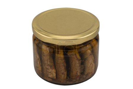 Sprats fish in a glass jar isolated on a white background with clipping path. Top view. Sprats in a glass can with oil. Smoked canned sprats isolated