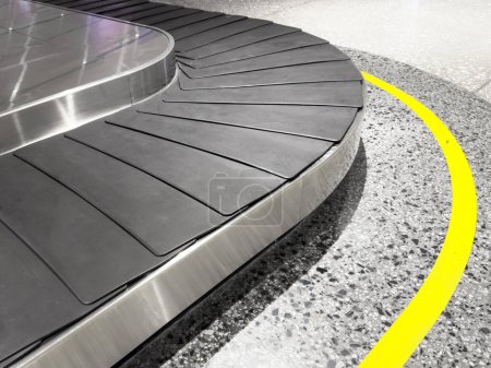 Photo for Baggage claim area. Long empty luggage claim line in international airport. luggage conveyor belt. Circulating conveyor belt in the baggage claim - Royalty Free Image
