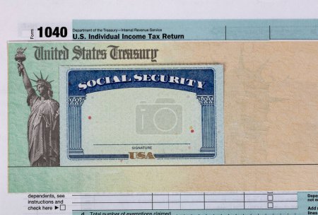 Photo for US IRS Internal Revenue Service income tax form with supporting documents such as social security card - Royalty Free Image