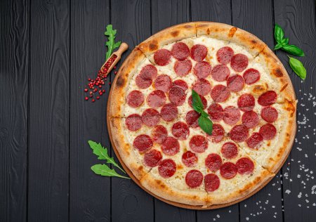 Photo for Homemade cheese pizza with salami, delicious pizza with cheddar. Italian food. - Royalty Free Image