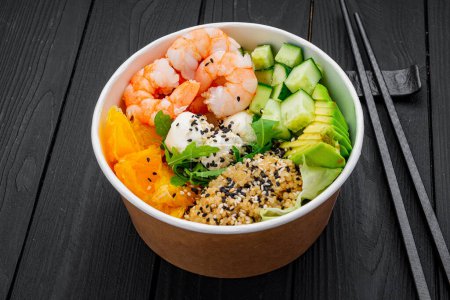 Poke bowl with shrimp, quinoa, avocado, cucumber, cream cheese and orange. Asian cuisine. Photo for the menu.