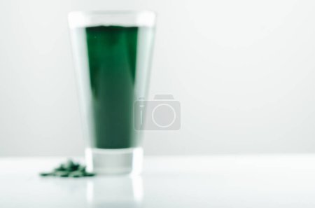 Photo for Minimalist glass with water and spirulina powder. High quality photo - Royalty Free Image