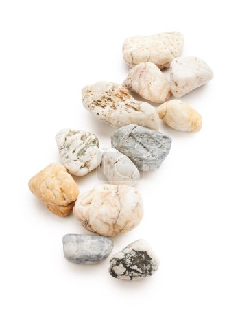 Foto de Spa stones isolated on white background. Zen still life arrangement - Imagen libre de derechos