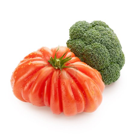 Foto de Fresh vegetables arrangement. Tomato and broccoli isolated on white background. Healthy food concept - Imagen libre de derechos