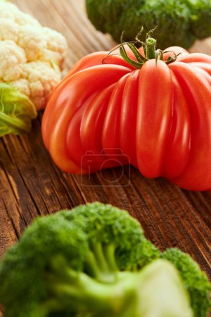 Photo for Food still life with tomato, broccoli and cabbage on wooden table - Royalty Free Image