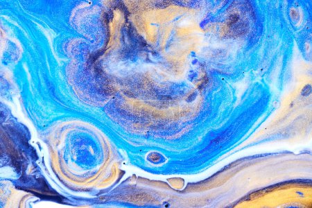 Foto de Pinturas azules y doradas textura. Papel jaspeado fondo abstracto - Imagen libre de derechos