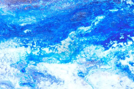 Foto de Pinta la textura en colores azul y blanco. Papel jaspeado fondo abstracto - Imagen libre de derechos