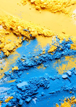 Photo for Blue and yellow crushed eye shadow texture background - Royalty Free Image