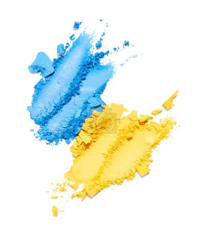 Foto de Sombra de ojos aplastada azul y amarilla aislada sobre fondo blanco - Imagen libre de derechos