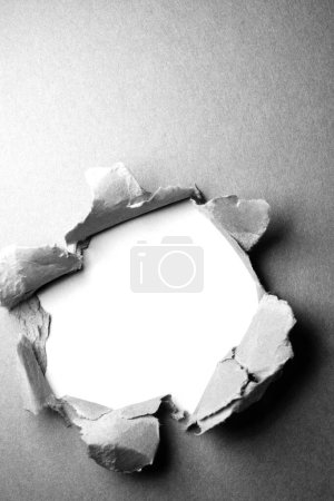 Photo for Gray ripped paper background with hole in the center - Royalty Free Image
