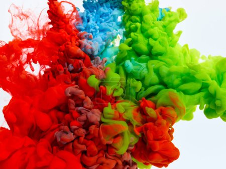 Photo for Splash of blue, red and green paints in water over white background - Royalty Free Image