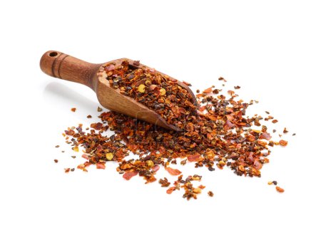 Photo for Crushed red pepper flakes in wooden spoon isolated on white background - Royalty Free Image