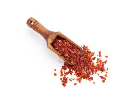 Photo for Crushed red pepper in wooden spoon isolated on white background - Royalty Free Image