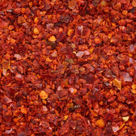 Téléchargez les photos : Crushed red pepper tas texture fond - en image libre de droit