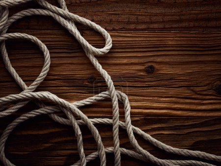 Photo for Dark vintage marine background with old hemp rope - Royalty Free Image