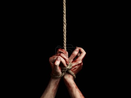 Photo for Woman hands with bloody stains tied with a rope over black background. Hostage - Royalty Free Image