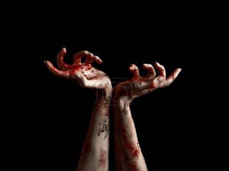 Foto de Manos espeluznantes de muertos vivientes con sangre goteando sobre fondo negro - Imagen libre de derechos