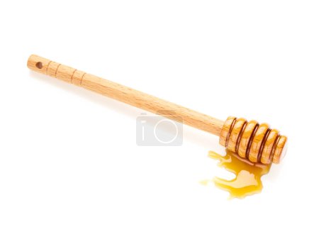 Foto de Honey with honey dipper isolated on white background - Imagen libre de derechos