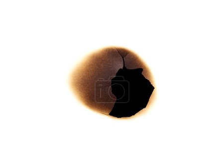 Foto de Agujero quemado en papel aislado sobre fondo blanco - Imagen libre de derechos