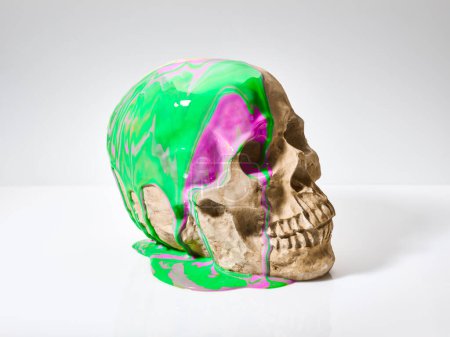 paints running down the human skull abstract background