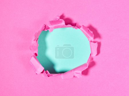 Photo for Ripped pink paper with hole in the center - Royalty Free Image