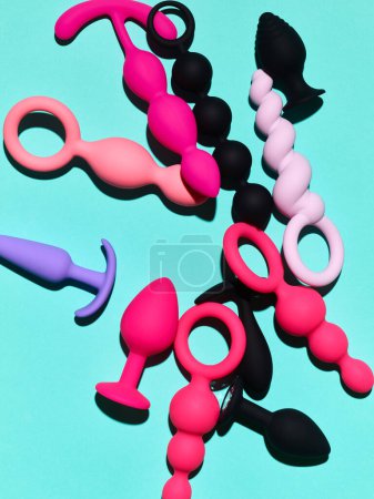 Foto de Sex toys background. anal plugs and dildo over blue backdrop - Imagen libre de derechos