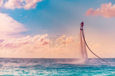 Photo for Man riding flyboard in the sea, active vacation concept - Royalty Free Image