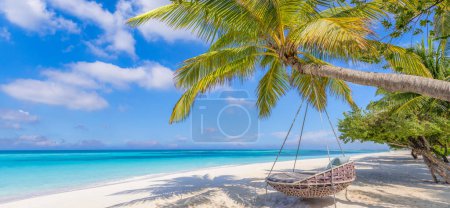 Photo for Tropical relax beach as summer island landscape with beach swing or hammock on palm, close to fantastic sea view. Amazing beach panorama vacation and summer holiday concept. Luxury panoramic travel - Royalty Free Image