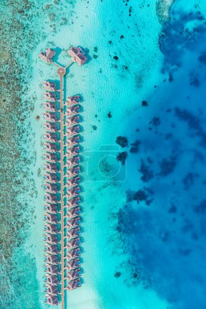 Photo for Picturesque aerial view of luxury tropical island resort water villas. - Royalty Free Image