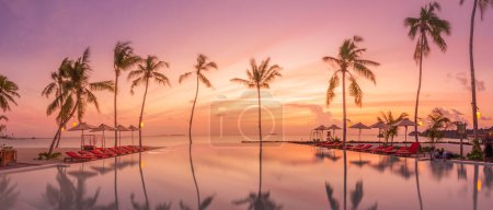 Photo for Outdoor tourism landscape. Luxurious beach resort with swimming pool and beach chairs or loungers - Royalty Free Image