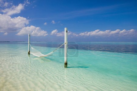 Photo for Tropical beach background as summer relax landscape with beach swing or hammock - Royalty Free Image
